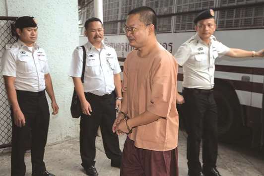 Wirapol Sukphol, former Thai Buddhist monk who provoked outrage with his lavish lifestyle arrives at the Criminal court in Bangkok, Thailand.
