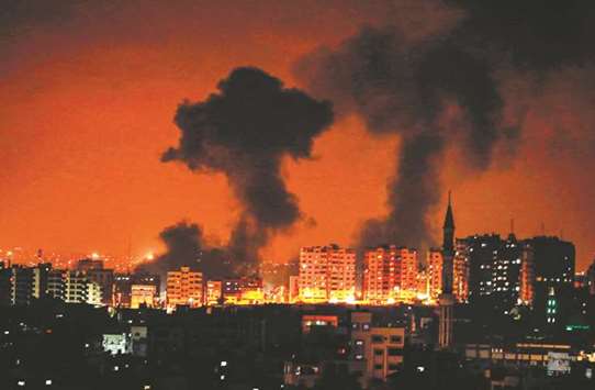 A Wednesday night photo of smoke plumes rising following an Israeli air strike on Gaza City.