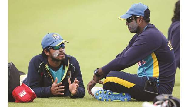 Sri Lankau2019s Angelo Mathews (right) and Dinesh Chandimal. (Reuters)
