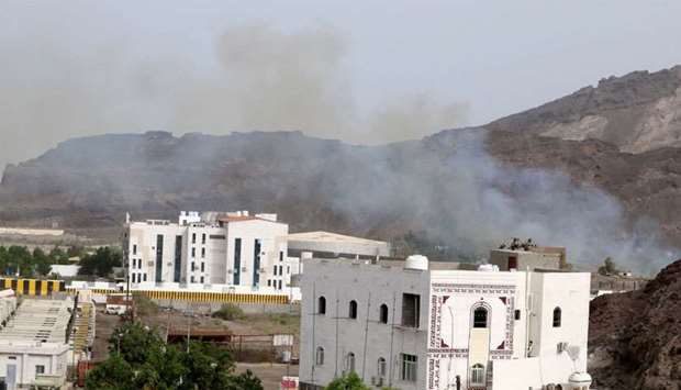 Smoke rises during clashes in Aden, Yemen