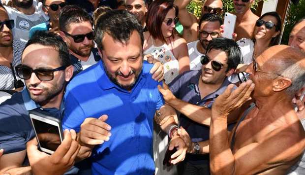 Italy's Interior minister and deputy Prime Minister Matteo Salvini looks on as he surrounded by supporters during his electoral tour ,Italian Summer Tour,, in Policoro, South of Italy