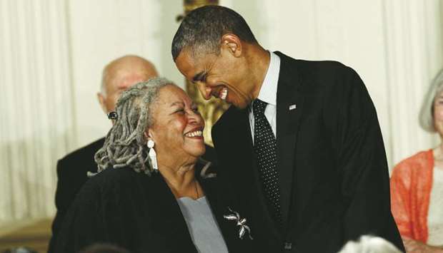 Novelist Toni Morrison smiles with US President Barack Obama as he prepares to award her a 2012 Presidential Medal of Freedom during a ceremony in the East Room of the White House in Washington, in this May 29, 2012, photograph.