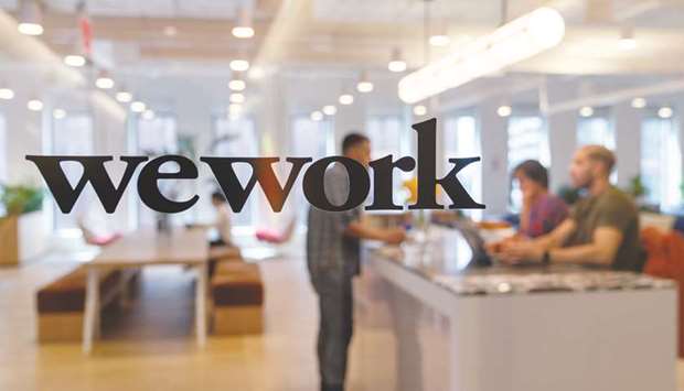 A signage is seen at the entrance of the WeWork Cos offices in Manhattan, New York.