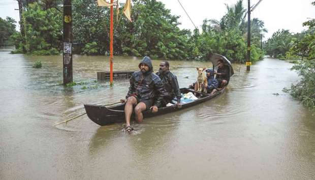 Residents being evacuated from their home following floods warnings in Kochi yesterday.