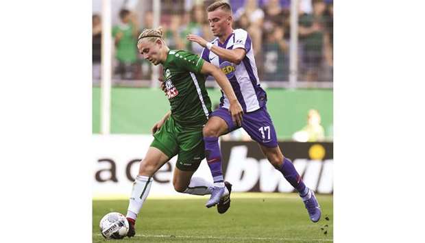 Hertha Berlinu2019s Maximilian Mittelstaedt (right) and Eichstaettu2019s Jakob Zitzelsberger vie for the ball during the German Cup match in Ingolstadt, southern Germany. (AFP)