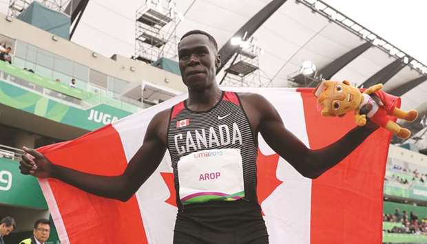 Canadau2019s Marco Arop celebrates his victory in the menu2019s 800m race at the Pan American Games in Lima on Saturday. (Reuters)