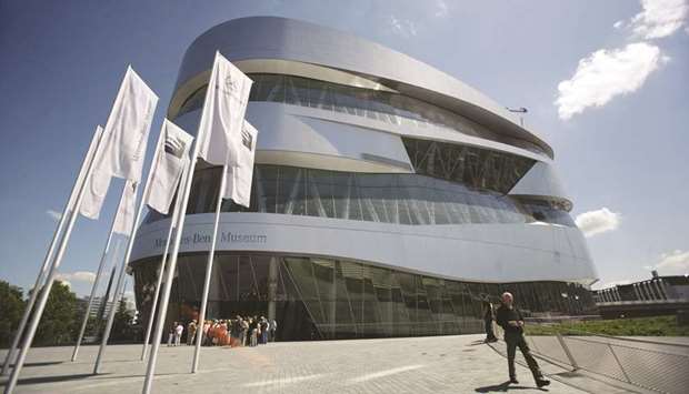 A view of the Mercedes Museum, part of the Daimler Chrysler headquarter, in Stuttgart. Big-name companies including Continental, Daimler, BASF and Lufthansa have all slashed their outlooks.