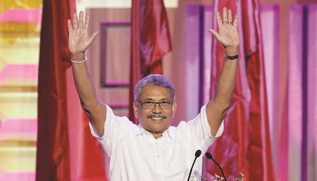 Sri Lankau2019s former defence secretary Gotabaya Rajapakse waves after he was nominated as a presidential candidate during the Sri Lanka Peopleu2019s Front party convention in Colombo.
