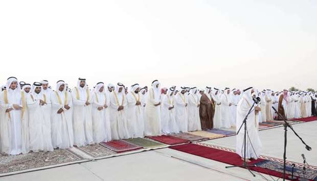His Highness the Amir Sheikh Tamim bin Hamad al-Thani performs Eid al-Adha prayer along with a number of their excellencies Sheikhs, ministers and members of diplomatic corps in addition to citizens, at Al Wajba praying area