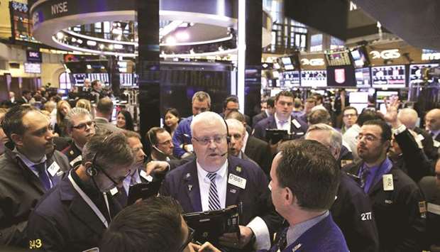 Traders work on the floor of the New York Stock Exchange (file).