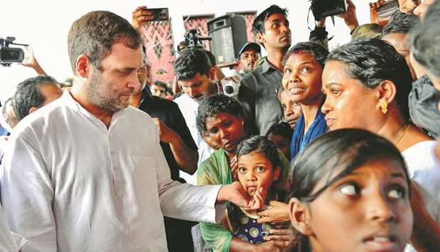 Former Congress chief Rahul Gandhi interacts with flood victims at Bhoothanam Christian Church Camp at Pothukal Panchayath in Malappuram district.