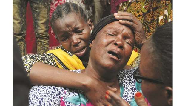 Relatives mourn their dead kin outside the Morogoro referral hospital in Morogoro, eastern Tanzania.