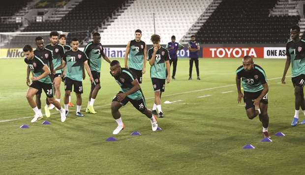 Al Duhail players take part in a training session on the eve of the AFC Champions League tie against Al Sadd yesterday. PICTURES: Anas Khalid