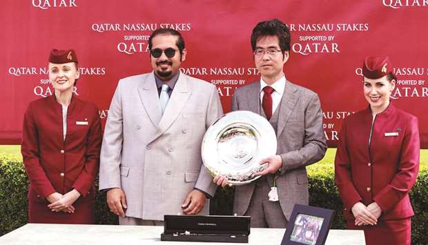 Qatar Racing and Equestrian Club (QREC) CEO Nasser bin Sherida al-Kaabi (second from left) crowned the winners of Qatar Nassau Stakes (Group 1) after Japanu2019s Deirdre won the 10-furlong contest at the Qatar Goodwood Festival yesterday. PICTURES: Juhaim and Zuzanna Lupa