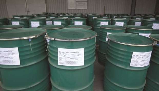 Drums of apple juice concentrate are stored at the China Haisheng Juice Holdings facility in Xiu2019an, Shaanxi province. Chinese apple juice exports have nosedived 93% in the first half of the year since US President Donald Trump hit them with tariffs in September last year.