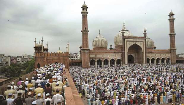 Devotees offer prayers during Eid al-Adha at Jama Masjid in New Delhi yesterday.