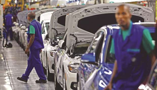 Painted BMW 3 Series automobiles pass along the production line during assembly at the Bayerische Motoren Werke plant in Rosslyn, South Africa (file).