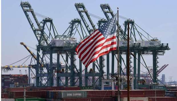 US flag flies over Chinese shipping containers that were unloaded at the Port of Long Beach, in Los Angeles County. File photo: September 29, 2018