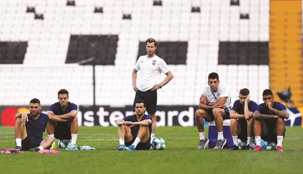 Chelsea players take a break during a training session yesterday on the eve of the UEFA Super Cup in Istanbul. (Reuters)