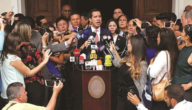 Venezuelan opposition leader Juan Guaido, who many nations have recognised as the countryu2019s rightful interim ruler, talks to the media as he attends a session of Venezuelau2019s National Assembly in Caracas, yesterday.