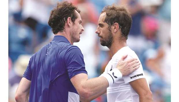 Andy Murray (left) of Great Britain congratulates Richard Gasquet of France on his win at the Western and Southern Open in Mason, United States, on Monday. (AFP)