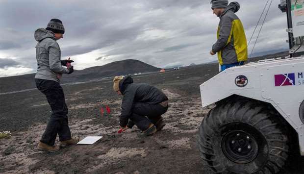Scientists working at the NASA base at the Lambahraun lava field in Iceland where they are getting their new robotic space explorer ready for the next mission to Mars