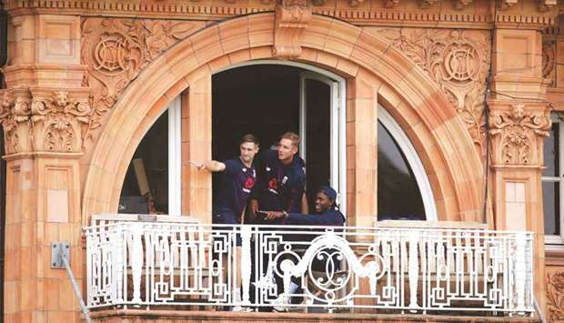 Englandu2019s Chris Woakes (left), Stuart Broad and Jofra Archer (right) at the Lordu2019s balcony in London as opening dayu2019s play of the second Test was washed out yesterday. (Reuters)