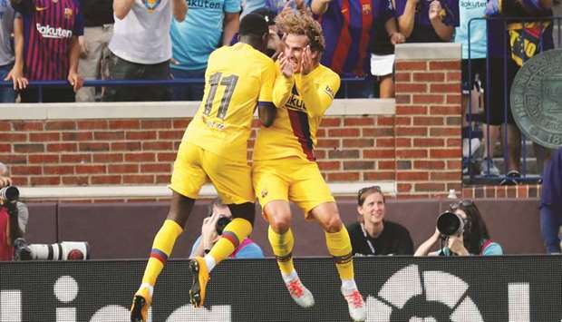Barcelonau2019s Ousmane Dembele (left) celebrates a goal with teammate Antoine Griezmann during a United States La Liga-Serie A Cup Tour match against Napoli in Ann Arbor, United States, on Saturday. (USA TODAY Sports)