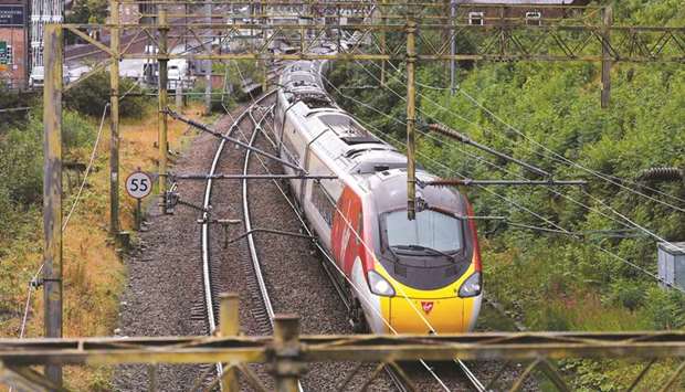 A Virgin Trains Mainline service from London to Manchester pulls out of the station in Macclesfield.