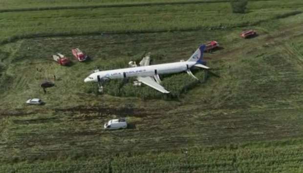 A still image, taken from a drone video footage, shows the Ural Airlines Airbus 321 passenger plane following an emergency landing in a field near Zhukovsky International Airport in Moscow Region, Russia