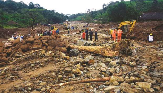 Volunteers, local residents, fire force officials and members of National Disaster Response Force (NDRF) search for survivors following landslides at Puthumala village in Keralau2019s Wayanad district on Wednesday.