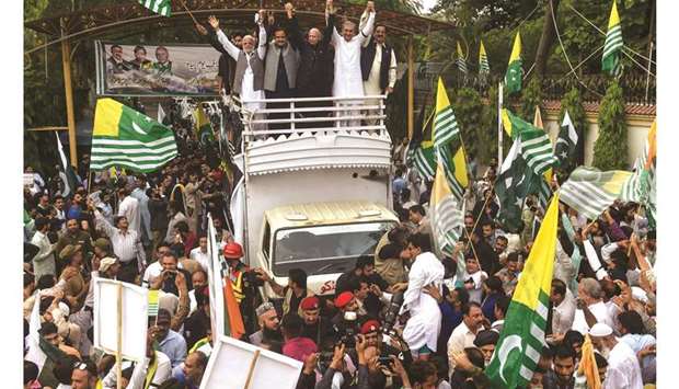 Foreign Minister Shah Mehmood Qureshi and other party leaders take part in a rally in Lahore yesterday against India, as the country observes u2018Black Dayu2019 on Indiau2019s Independence Day over the recent move to strip Indian-administered Kashmir of its autonomy.