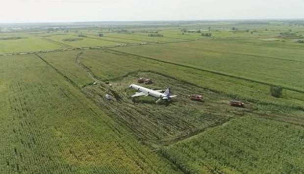 This still image taken from a drone video footage shows the Ural Airlines Airbus 321 passenger plane following an emergency landing in a field near Zhukovsky International Airport in Moscow Region.