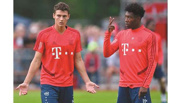 Bayern Munichu2019s David Alaba (right) talks to Benjamin Pavard during a training session in Rottach-Egern, Germany. (AFP)