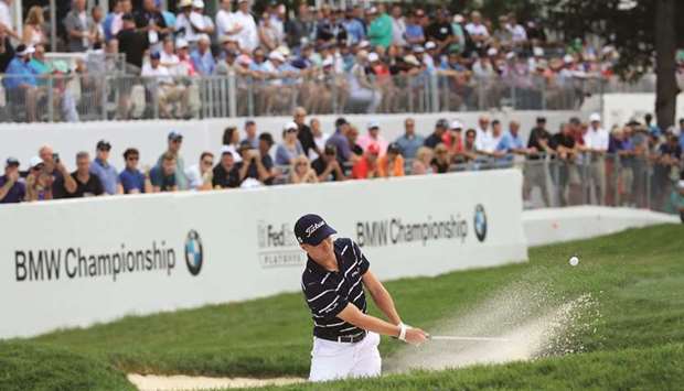Justin Thomas of the US plays a shot from a bunker on the 18th hole during the first round of the BMW Championship in Medinah, Illinois. (AFP)
