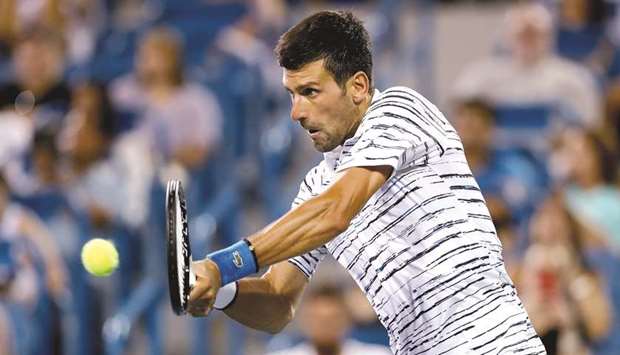 Novak Djokovic of Serbia returns a shot to Lucas Pouille of France during the Western & Southern Open at Lindner Family Tennis Center in Mason, Ohio. (Getty Images/AFP)