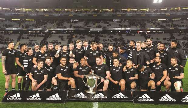 New Zealandu2019s players celebrate after winning the Rugby Championship Bledisloe Cup Test match against Australia in Auckland yesterday. (AFP)
