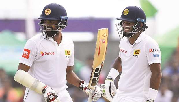 Sri Lanka Dimuth Karunaratne (right) and Lahiru Thirimanne have both scored unbeaten half centuries in the second innings. (AFP)