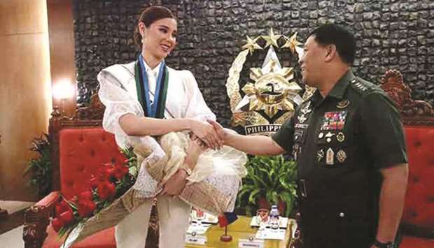 Armed Forces chief Gen Benjamin Madrigal Jr welcomes Miss Universe 2018 Catriona Gray to Camp Aguinaldo in Quezon City, the militaryu2019s headquarters.