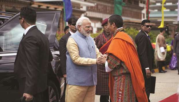 Prime Minister Narendra Modi is welcomed by his Bhutanese counterpart Lotay Tshering at Paro airport yesterday.