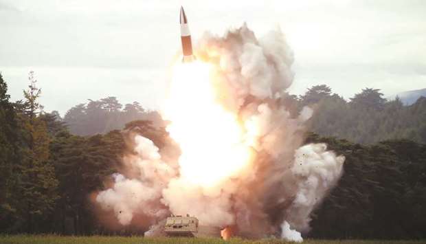 This picture released yesterday by Korean Central News Agency (KCNA) shows the test-firing of a new weapon, presumed to be a short-range ballistic missile, at an undisclosed location.