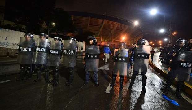 National riot police guard the Tiburcio Carias Andino stadium, where fans rioted in Tegucigalpa, Honduras yesterday night.