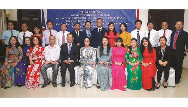 Truong Thi Mai and Nguyen Dinh Thao with members of the Vietnamese community in Qatar. PICTURES: Jayaram