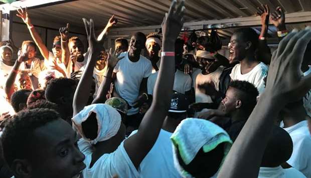Rescued migrants gesture as they gather on deck of the 'Ocean Viking' rescue ship, operated by French NGOs SOS Mediterranee and Medecins sans Frontieres (MSF). File picture: August 13, 2019