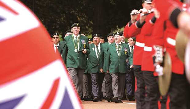 Veterans take part in a parade at a memorial event organised by the Northern Ireland Veterans Association in Lisburn, south of Belfast, to mark the 50th anniversary of the start of Operation Banner, the arrival of British troops on the streets of Northern Ireland in 1969.