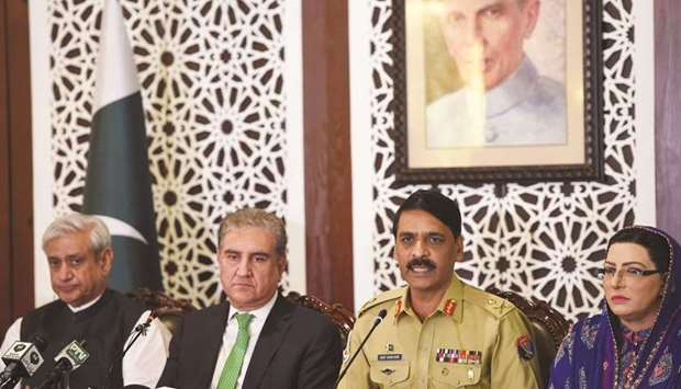 Chairperson of the parliamentary committee on Kashmir Fakhar Imam (left), Qureshi, Major-General Ghafoor, and Awan address a press conference at the foreign ministry in Islamabad.