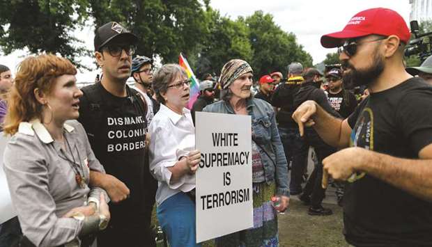 Counter-demonstrators confront alt-right groups during the u2018End Domestic Terrorismu2019 rally at Tom McCall Waterfront Park in Portland on Saturday.