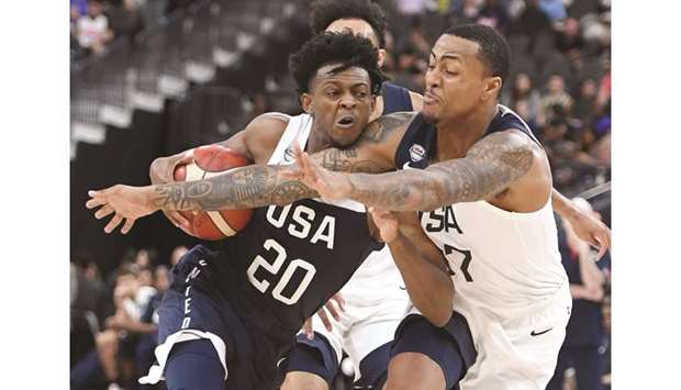 In this file photo taken on August 10, 2019, Deu2019Aaron Fox (left) of the 2019 USA Menu2019s National Team is fouled as he drives against John Collins of the 2019 USA Menu2019s Select Team during their exhibition game in Las Vegas. (AFP)