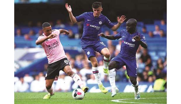 Leicester Cityu2019s Youri Tielemans (left) vies for the ball with Chelseau2019s Mason Mount (centre) and Nu2019Golo Kante during the Premier League match at Stamford Bridge in London yesterday. (Reuters)
