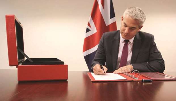 Brexit Secretary Stephen Barclay signs the commencement agreement to leave the EU in this picture obtained from social media.